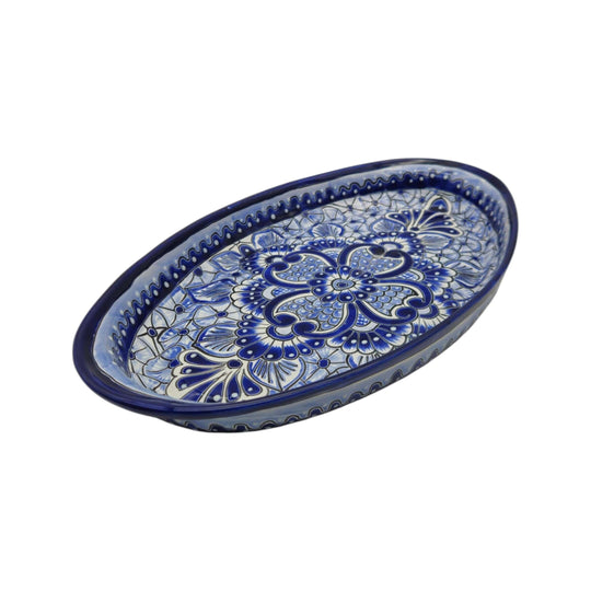 The Talavera Hub oval serving platter featuring intricate hand-painted blue and white floral Mexican ceramic patterns.