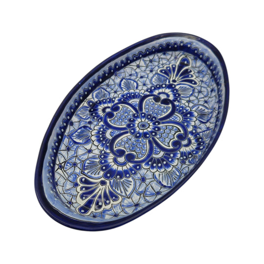 The Talavera Hub oval serving platter with intricate hand-painted blue and white floral Mexican ceramic patterns.