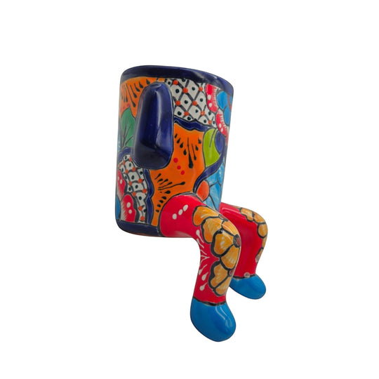 The Talavera Hub colorful ceramic planter with arms and legs, hand-painted with floral designs.