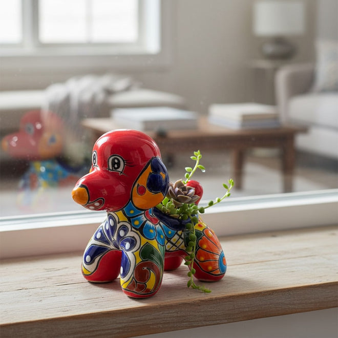 The Talavera Hub handcrafted ceramic poodle planter featuring vibrant hand-painted Mexican folk art patterns.