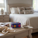 The Talavera Hub hand-painted purple ceramic Guerrero jewelry box with floral patterns on a bedroom vanity table.