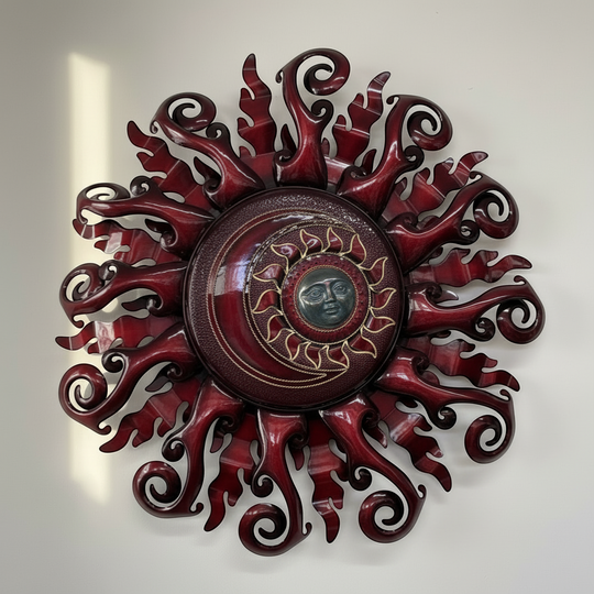 The Talavera Hub large red metal sun wall art with a face and light fixture. Handmade Mexican metalwork.