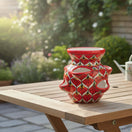 The Talavera Hub red ceramic strawberry planter with peacock design and side pockets, 10.5" tall.