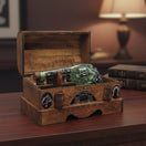 The Talavera Hub handblown Mexican revolver decanter set in a rustic wooden chest with six shot glasses. Clear glass with etched details.