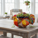 The Talavera Hub handcrafted ceramic rooster planter, hand-painted with vibrant red, yellow, blue, and green Talavera patterns.