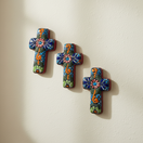The Talavera Hub set of 3 small, handcrafted ceramic crosses with colorful floral and scroll designs.