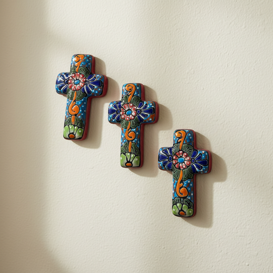 The Talavera Hub set of 3 small, handcrafted ceramic crosses with colorful floral and scroll designs.
