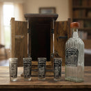 The Talavera Hub handmade shot glass and decanter set in rustic wood box. Clear glass with black and silver tequila design.
