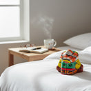 The Talavera Hub hand-painted ceramic Panchito figurine of a sleeping man, featuring vibrant colors and traditional Mexican folk art patterns.