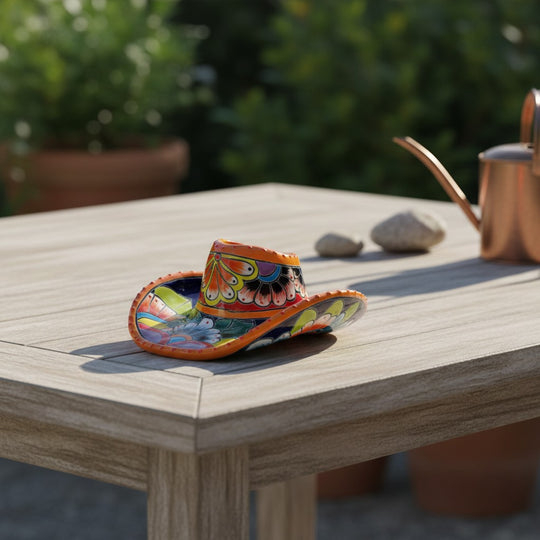 The Talavera Hub small sombrero planter, hand-painted with vibrant floral and geometric Talavera patterns in blue, orange, yellow, and green.