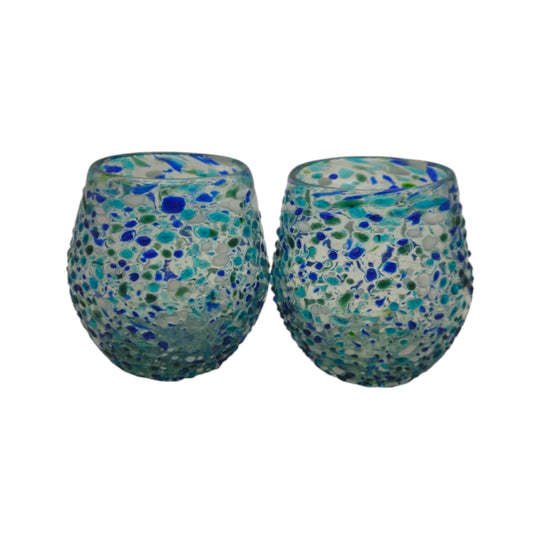 The Talavera Hub hand blown stemless wine glass with blue, green, and white confetti design. Made from recycled glass.
