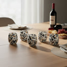 The Talavera Hub hand-blown stemless wine glasses with blue, mocha, and white speckle design. Set of 6, 12 oz capacity.