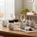 The Talavera Hub XL stemless wine glasses with colorful confetti rock design, hand-blown glass, 24 oz capacity.