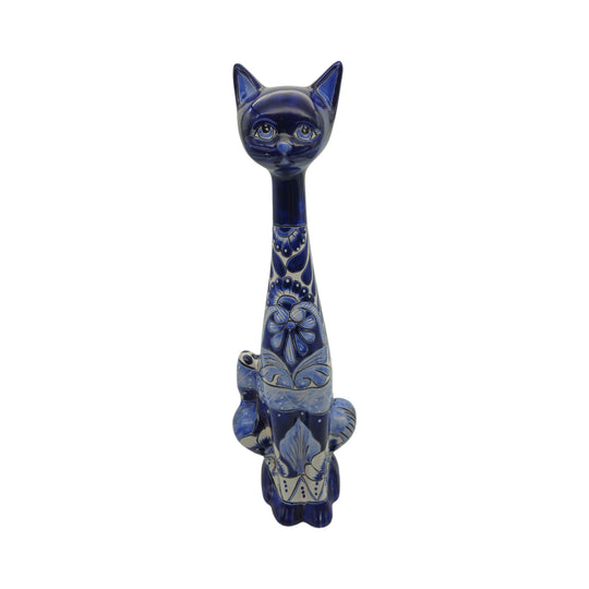 The Talavera Hub tall handmade ceramic cat statue featuring intricate blue and white floral Mexican folk art patterns.