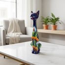 The Talavera Hub Tall Talavera Cat Statue, handmade ceramic with sunflower design, blue glaze, 19.5 inches.