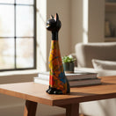 The Talavera Hub tall cat statue featuring a black head and base with a vibrant floral terracotta body design.