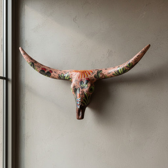 The Talavera Hub handcrafted terracotta longhorn skull wall decor with vibrant hand-painted desert cactus motifs.