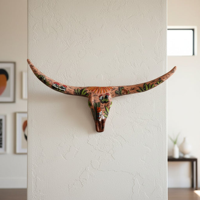 The Talavera Hub handcrafted terracotta longhorn skull wall decor with vibrant hand-painted desert cactus motifs.