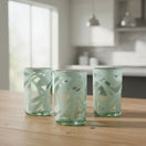 The Talavera Hub hand-blown clear glass drinking glasses with white swirl pattern, 18 oz capacity.