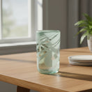 The Talavera Hub hand-blown glass drinking glass with white swirl pattern, 18 oz capacity.