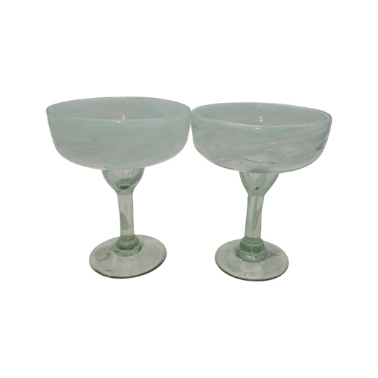 The Talavera Hub two hand-blown clear margarita glasses with white swirls on the rim, 12 oz capacity.
