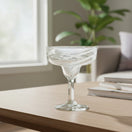 The Talavera Hub clear hand-blown margarita glass with white swirl pattern on rim and stem, 12 oz capacity.