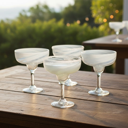 The Talavera Hub two hand-blown clear glass margarita glasses with white swirl accents on the rim. Each holds 12 oz.