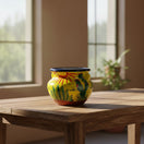 The Talavera Hub yellow ceramic cactus planter with desert motifs and a sun design. Handcrafted in Mexico.