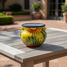 The Talavera Hub yellow ceramic cactus planter with desert motifs and handles. Handcrafted in Mexico, 10" tall.