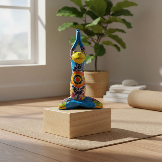 The Talavera Hub handmade Mexican Talavera yoga frog statue with colorful hand-painted floral patterns on a wood block
