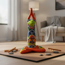 The Talavera Hub handmade Mexican ceramic frog statue in a yoga pose with colorful hand-painted folk art patterns.