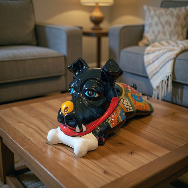 The Talavera Hub black ceramic dog decor with bone, hand-painted with vibrant blue eyes and colorful body details.
