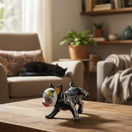 The Talavera Hub black ceramic chihuahua figurine with Day of the Dead skull face and skeleton details.