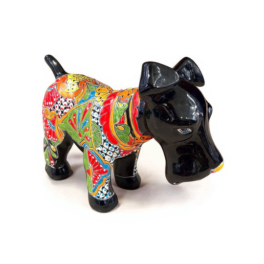 The Talavera Hub black ceramic dog sculpture with vibrant, hand-painted floral Talavera patterns.