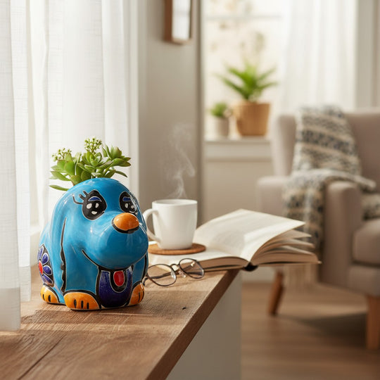 The Talavera Hub blue hand-painted Talavera dog planter with orange nose and paws, black eyes, and colorful details.