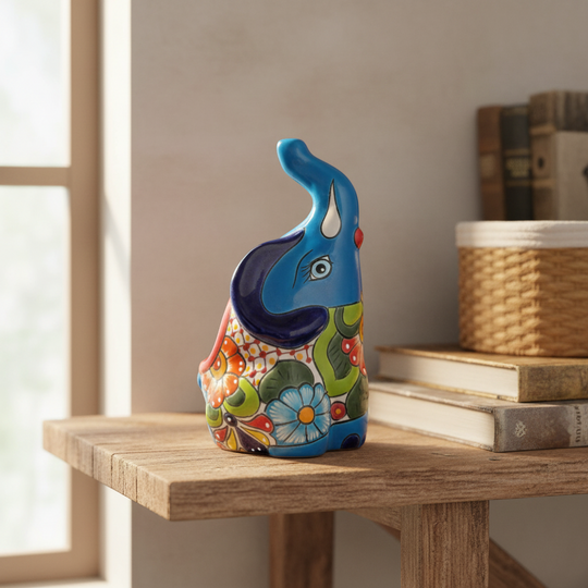 The Talavera Hub handmade blue ceramic elephant planter with colorful floral Talavera art. Medium size.