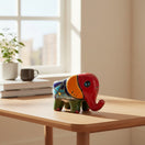 The Talavera Hub hand-painted ceramic elephant planter in red, orange, green, and blue with floral patterns. Small pot for succulents.