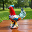 The Talavera Hub handcrafted ceramic rooster statue, hand-painted with vibrant colors and intricate folk art details.