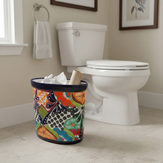 The Talavera Hub handmade ceramic oval trash can with vibrant floral and geometric Talavera designs in blue, orange, green, and red.