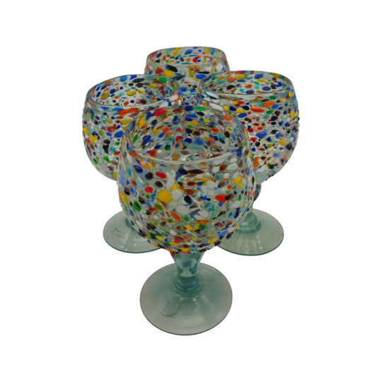 The Talavera Hub Mexican Margarita Glass with fish bowl shape, confetti pebble design in red, blue, green, yellow, white. Hand-blown recycled glass.