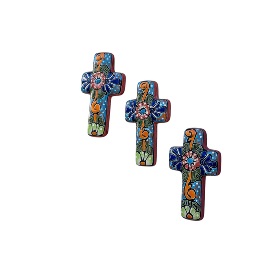 The Talavera Hub set of 3 small handcrafted ceramic crosses, hand-painted with blue, red, green, orange floral designs.