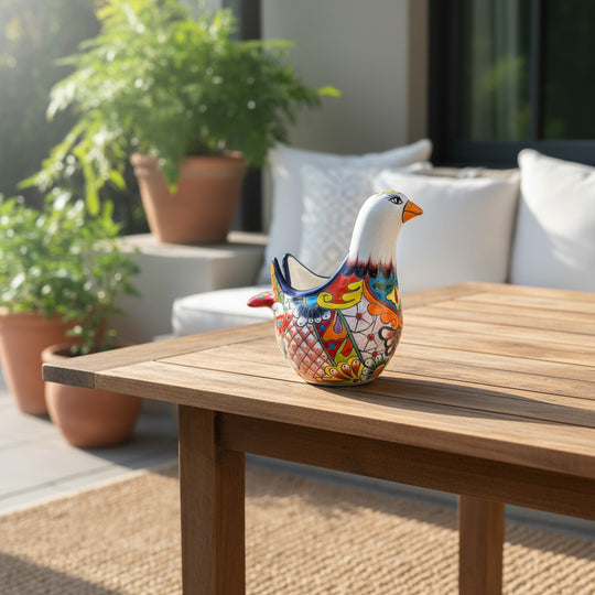 The Talavera Hub large white ceramic dove planter with vibrant hand-painted floral and feather designs in blue, orange, yellow, and red.