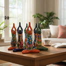 The Talavera Hub large ceramic frog statue in yoga pose, hand-painted with vibrant floral Talavera patterns.