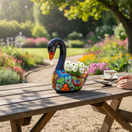The Talavera Hub large blue ceramic swan planter, hand-painted with colorful floral designs and an orange beak.