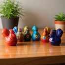 The Talavera Hub hand-painted ceramic chicken salt and pepper shakers in vibrant colors with floral designs.