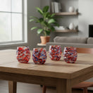 The Talavera Hub hand-blown stemless wine glasses with orange, blue, and white swirl pattern. Set of 6.