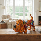 The Talavera Hub medium orange hound dog statue with colorful floral Talavera art. Handcrafted ceramic Mexican dog art.