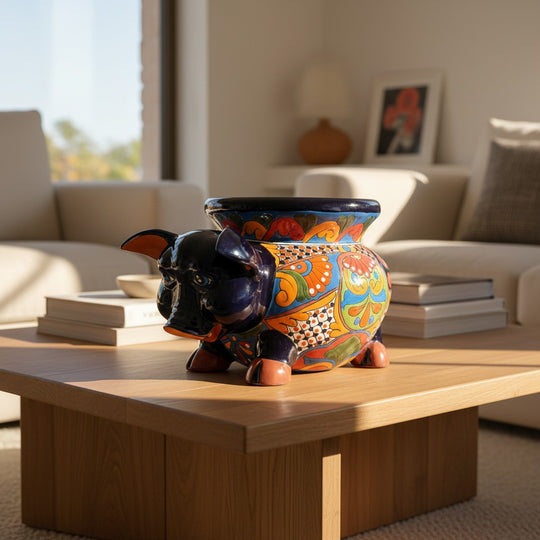 The Talavera Hub hand-painted ceramic pig planter with colorful floral and geometric patterns. Features a glossy finish and wide opening.