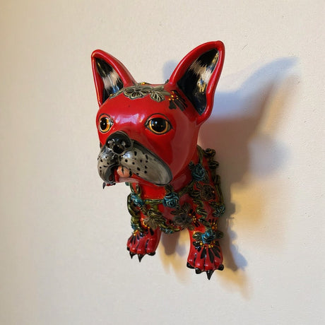 The Talavera Hub red French Bulldog statue, handcrafted ceramic with floral accents, wall art.
