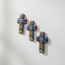 The Talavera Hub set of 3 small, hand-painted ceramic crosses with floral designs in blue, orange, and green.